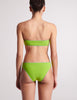 On model image of back of green bandeau bikini  top and bottom