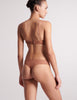 back view on model of woman in honey lace bra and panty