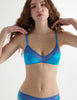 Front view of the woman in blue silk beatrice bra