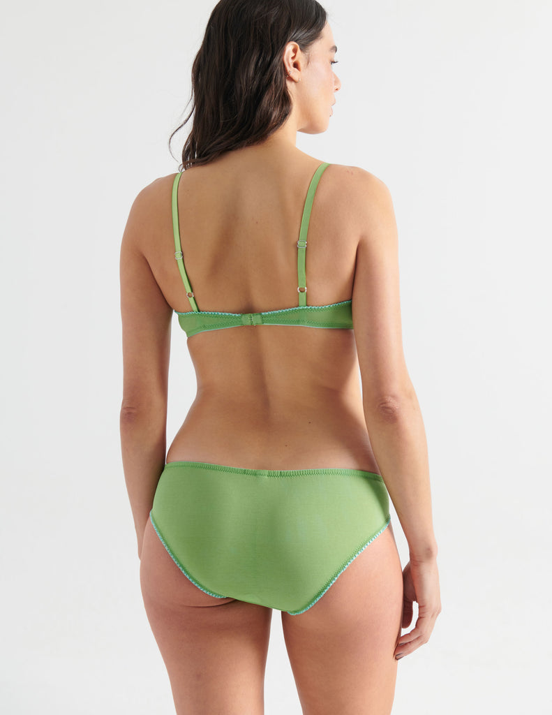 back of woman in green cotton bra and panty