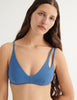 a model in elias bikini top in fog blue 