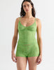 Front view image of model wearing green lace shorts with matching cami top. . 