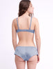 back of woman in grey silk bra and panty