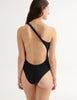 back view of a model wearing nico one piece in black 