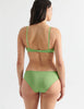 Back of Woman in Green cotton bralette with aqua silk