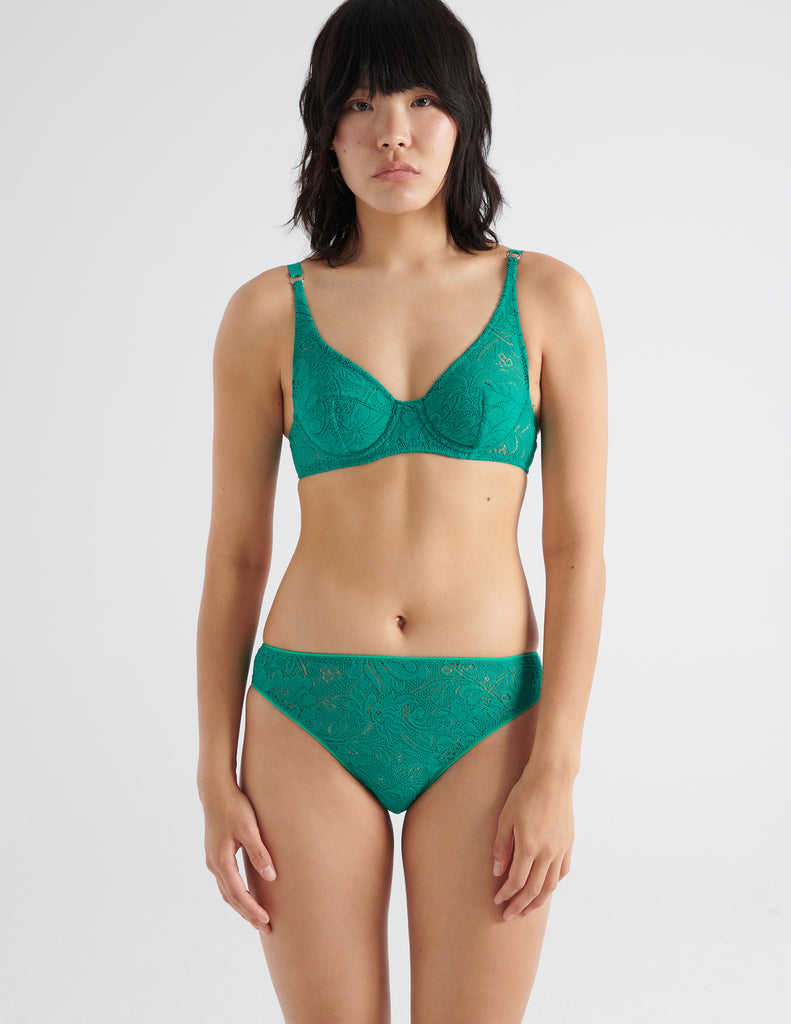 front view image of model wearing green lace underwire bra and panty