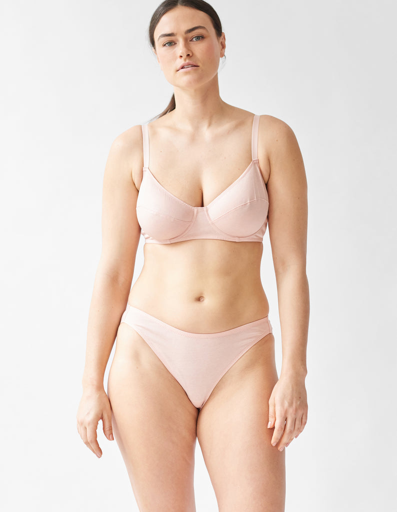woman wearing beige underwire bra and matching panty