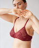 woman wearing red lace bra by Araks