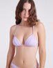 detail shot of woman wearing purple string bikini