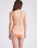 Back of model image, orange silk triangle bra and matching panty 