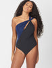 Front view of a woman wearing a black and navy one piece swimsuit
