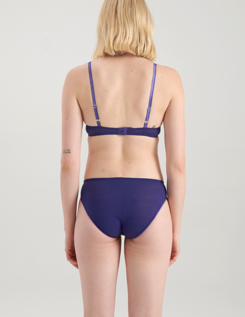 back view of blue cotton bralette with brown silk insert