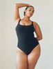 A model wearing the Usha one piece swimsuit in black