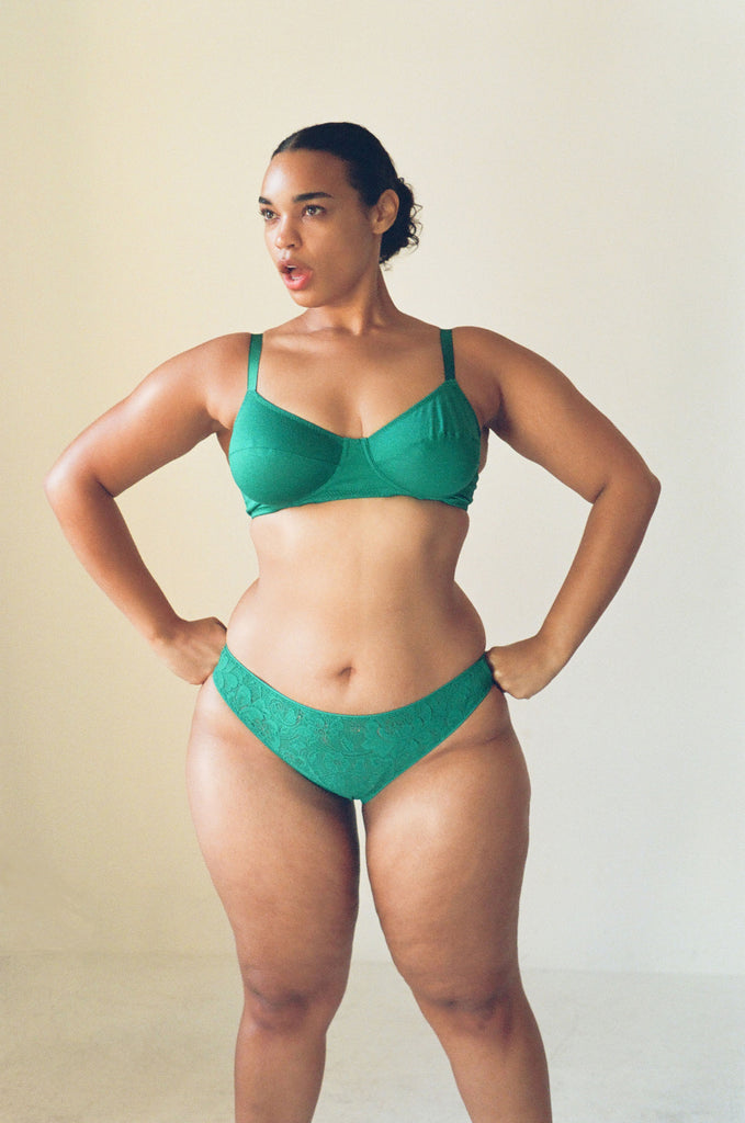 A model wearing the Beau bra in green cotton