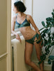 Model wearing Araks Willow bralette in Aegean blue