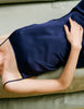 Model wearing Araka vika slip dress in starling