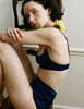 A model wearing Araks gita bra and Vera panty in Starling 