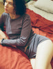 A model wearing a Sabine long sleeve top and Presley shorts in Violette