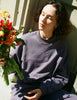 A model posing in the Araks Valerie crewneck in the shade Violette 