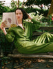 Model wearing Araks Vivienne sweatshirt and Vero sweatpant in moss