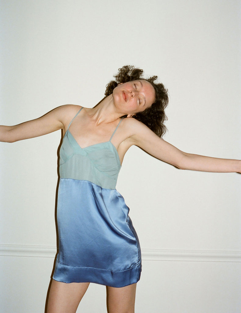 A model wearing the Holly Slip in light blue silk