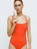 A model in the araks tallulah one piece in papaya orange
