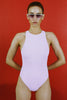 A model in the araks tolle one piece in ballet pink