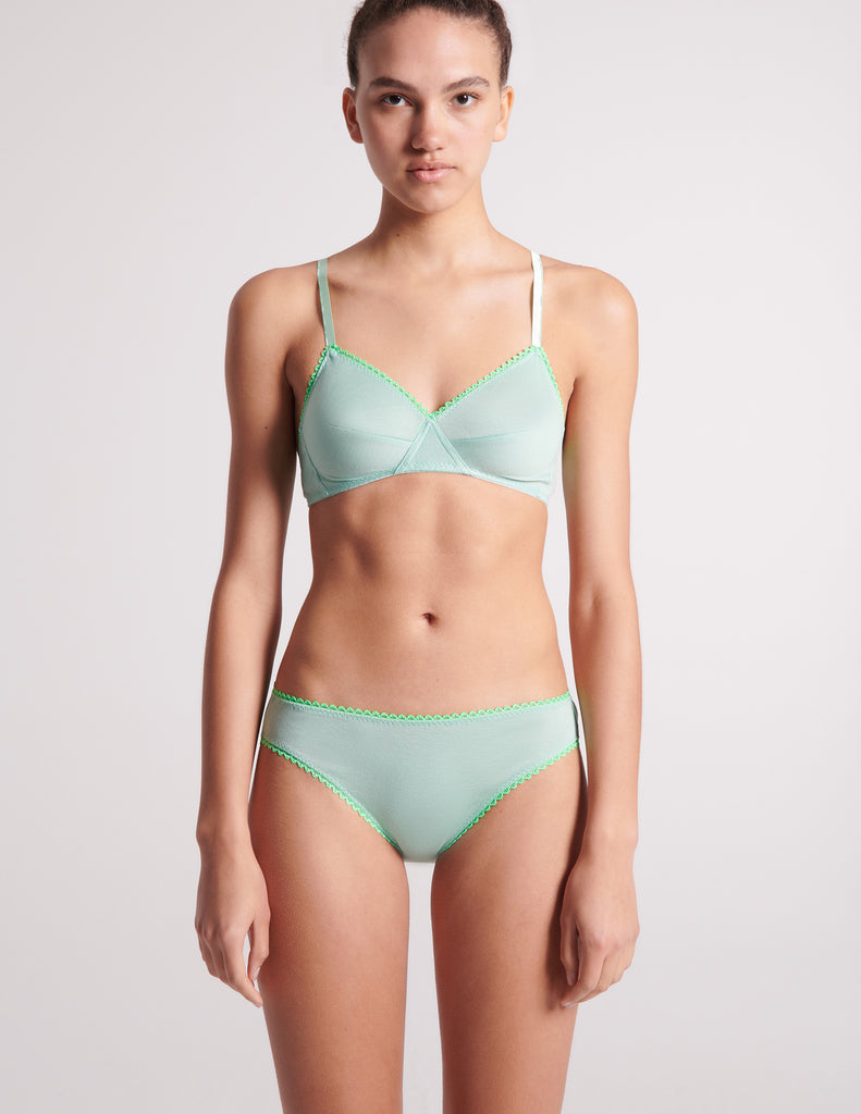 woman in light green cotton bralette and panty