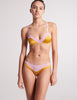 front view of woman in pink and yellow silk bra and panty