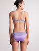 back view of woman in purple silk bra and panty