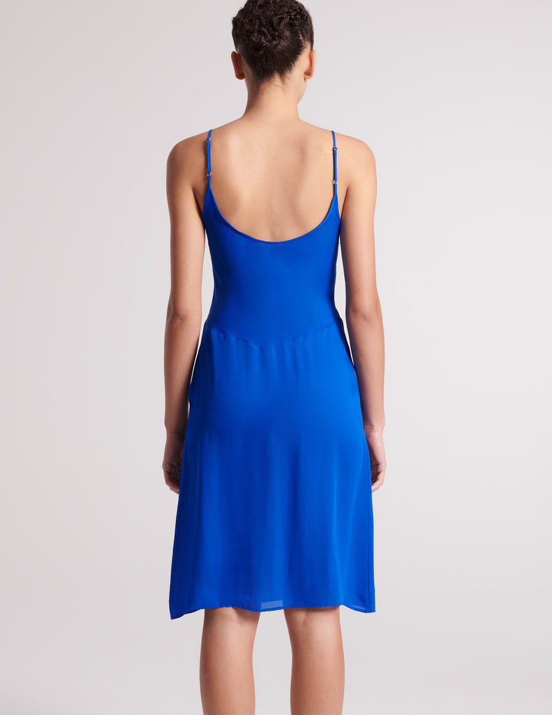 back view of woman in blue slup
