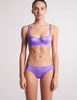 On model front image of purple silk bra and panty 