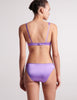 Back shot on model of purple silk bra and panty 