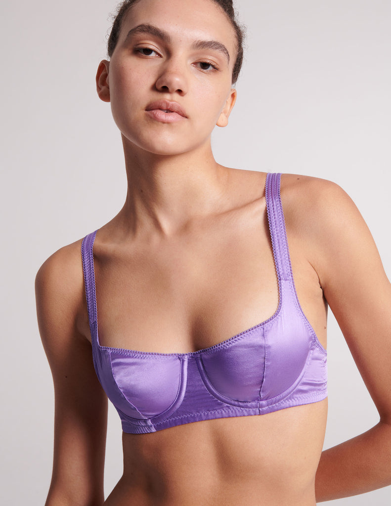Detail shot on model of purple silk bra