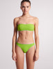 On model image of green bandeau bikini top and bottom