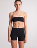 on model image of black bandeau swim top and black swim short 