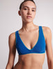 On model, 3/4 image of blue bikini top