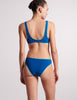 On model shot of backside of blue bikini top and bottom