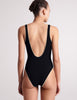 On model image of back view of black one piece swimsuit