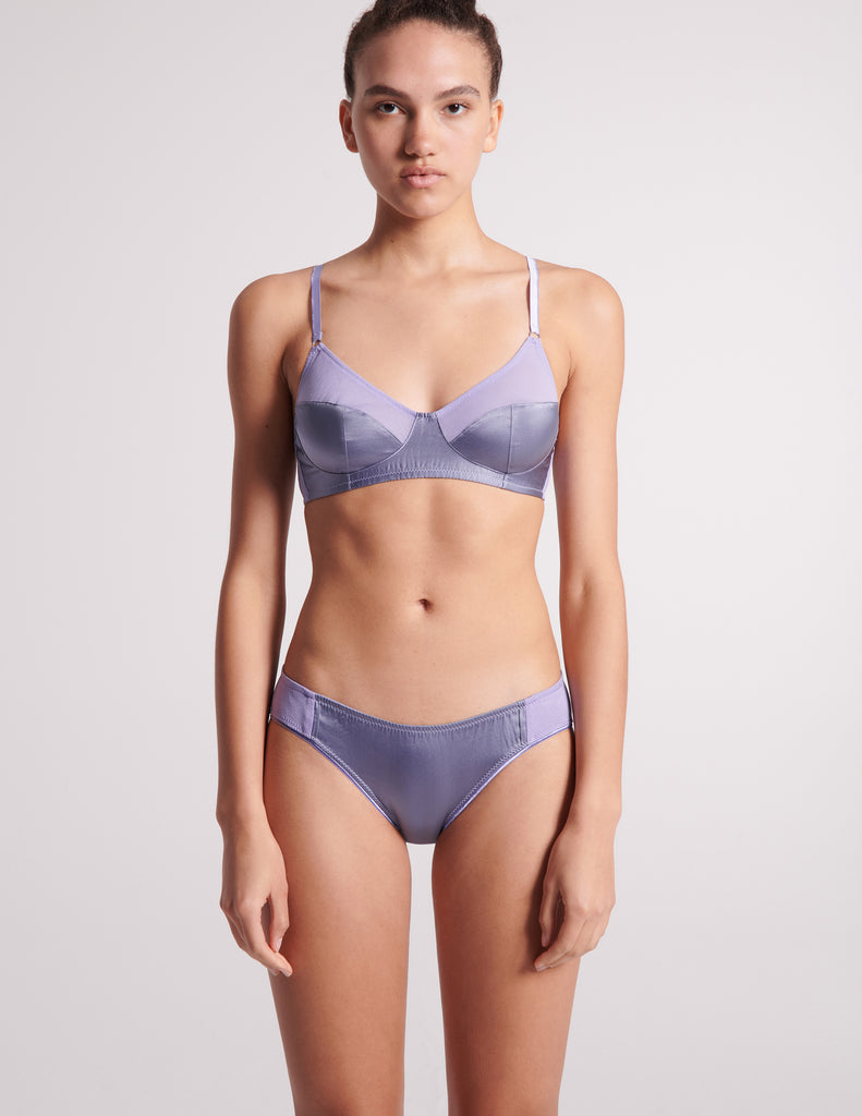 On model image of blue cotton with purple silk bralette and blue cotton with purple silk panty.