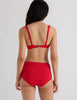 Model wearing Araks Ulija bikini top and Mallory bikini bottom in scarlet