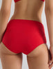 Model wearing Araks Ulija bikini top and Mallory bikini bottom in scarlet