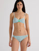 A model in the araks uma bralette and harriet panty in verona blue