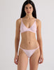 A model in the araks recycled cotton bisoux panty in confection pink