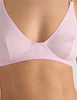 A model in the araks recycled cotton briar bralette in confection pink