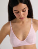 A model in the araks recycled cotton briar bralette in confection pink