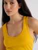 A model in the araks organic cotton james tank and presley short in pomelo yellow