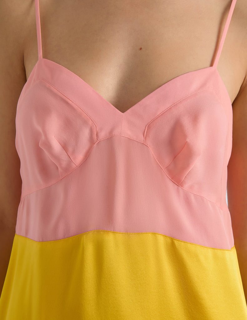 A model in the araks silk charmeuse holly slip in pomelo yellow