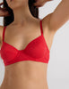 A model in the araks beau underwire bra in recycled cotton in scarlet red