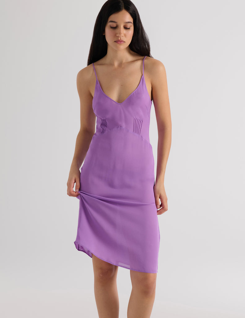 A model in the araks silk cadel slip in viola purple